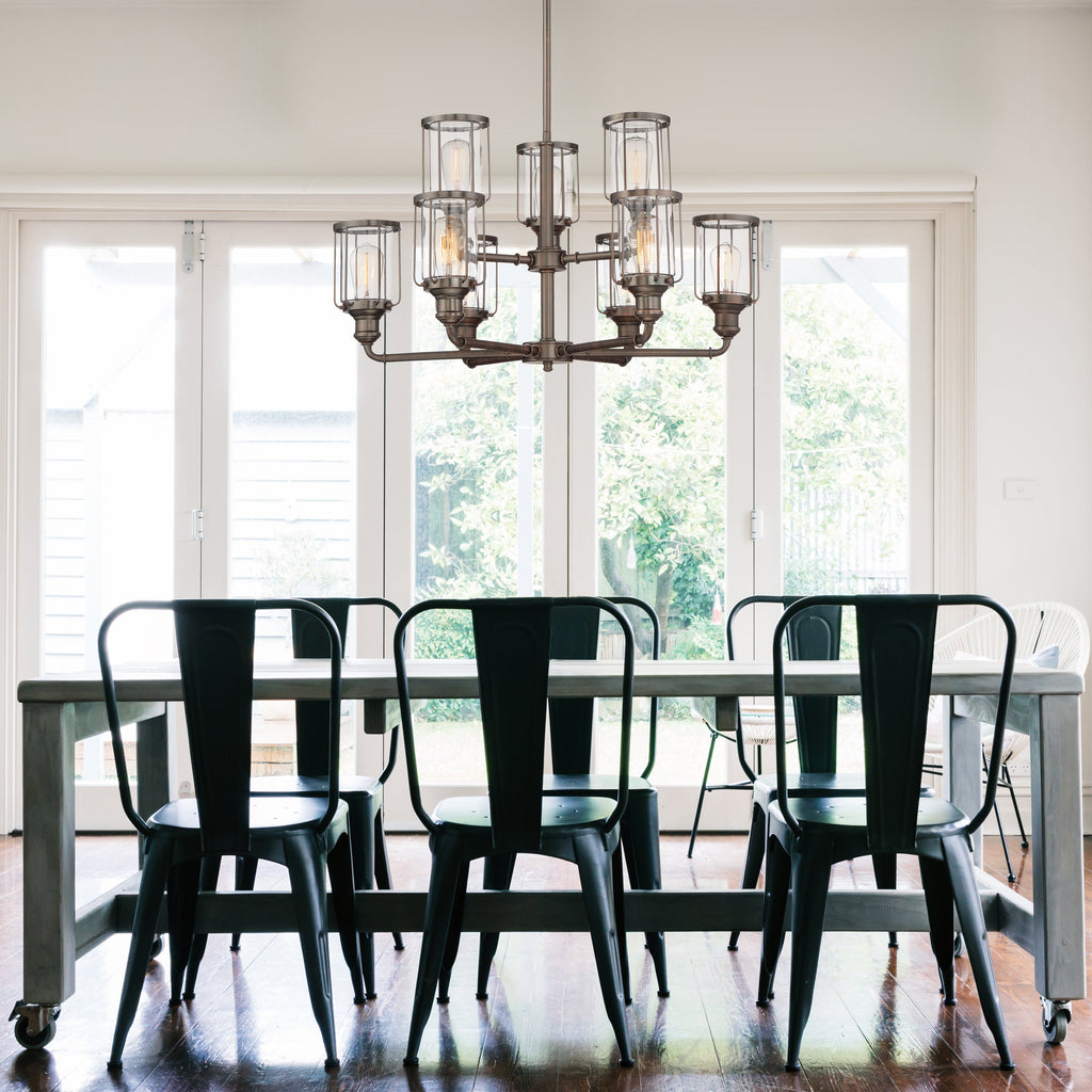 Dining room with a table and chairs under a chandelier
