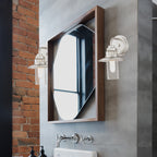 Modern bathroom with white sink, mirror, and shower area.