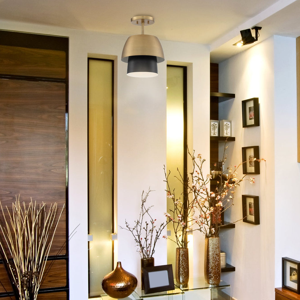 Modern living room with a television, decorative vases, and wall art.