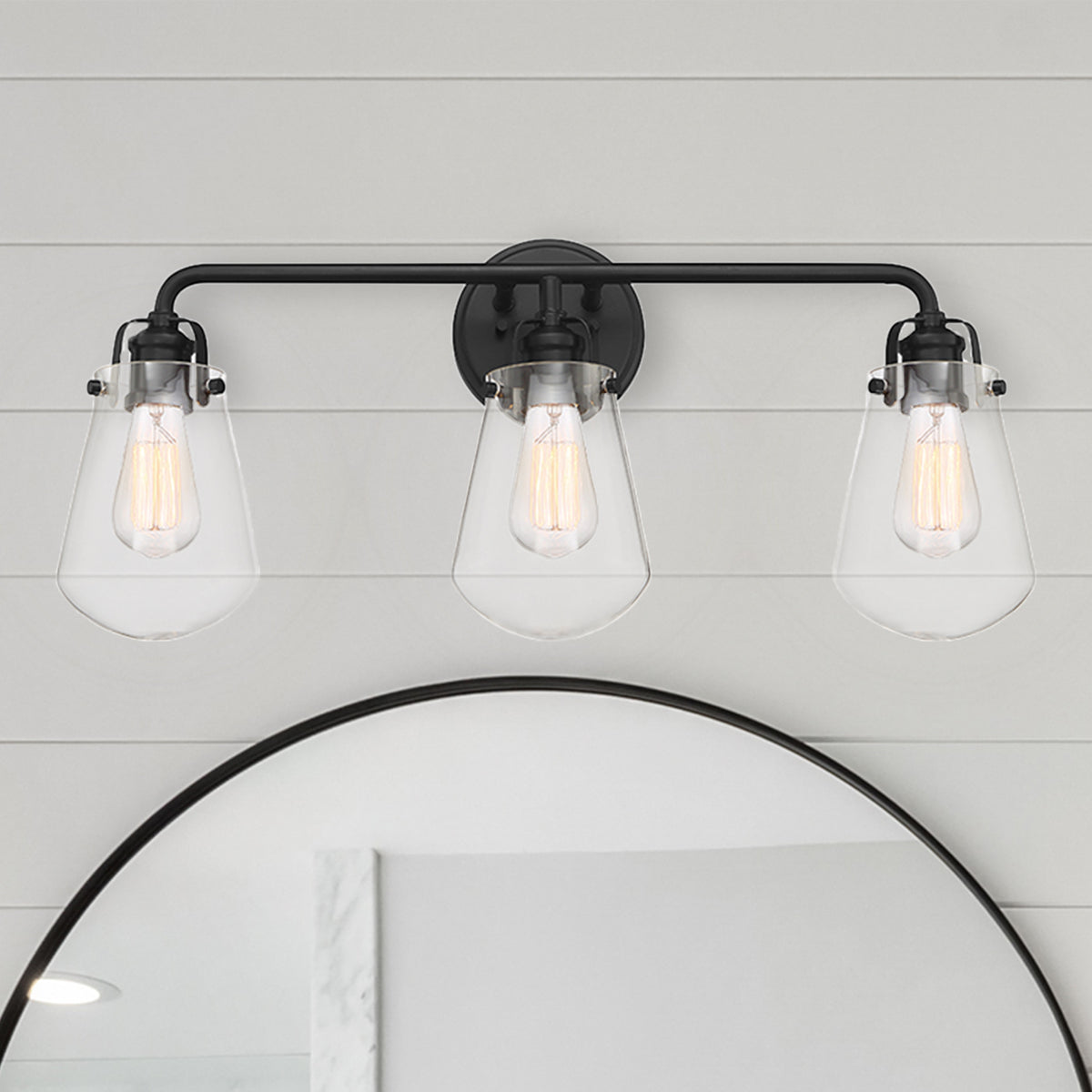 Elliott 24 in. 3-Light Matte Black Industrial Vanity Light with Clear Glass Shades for Bathrooms