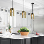 Modern kitchen with white cabinets, gray island, and stainless steel appliances.