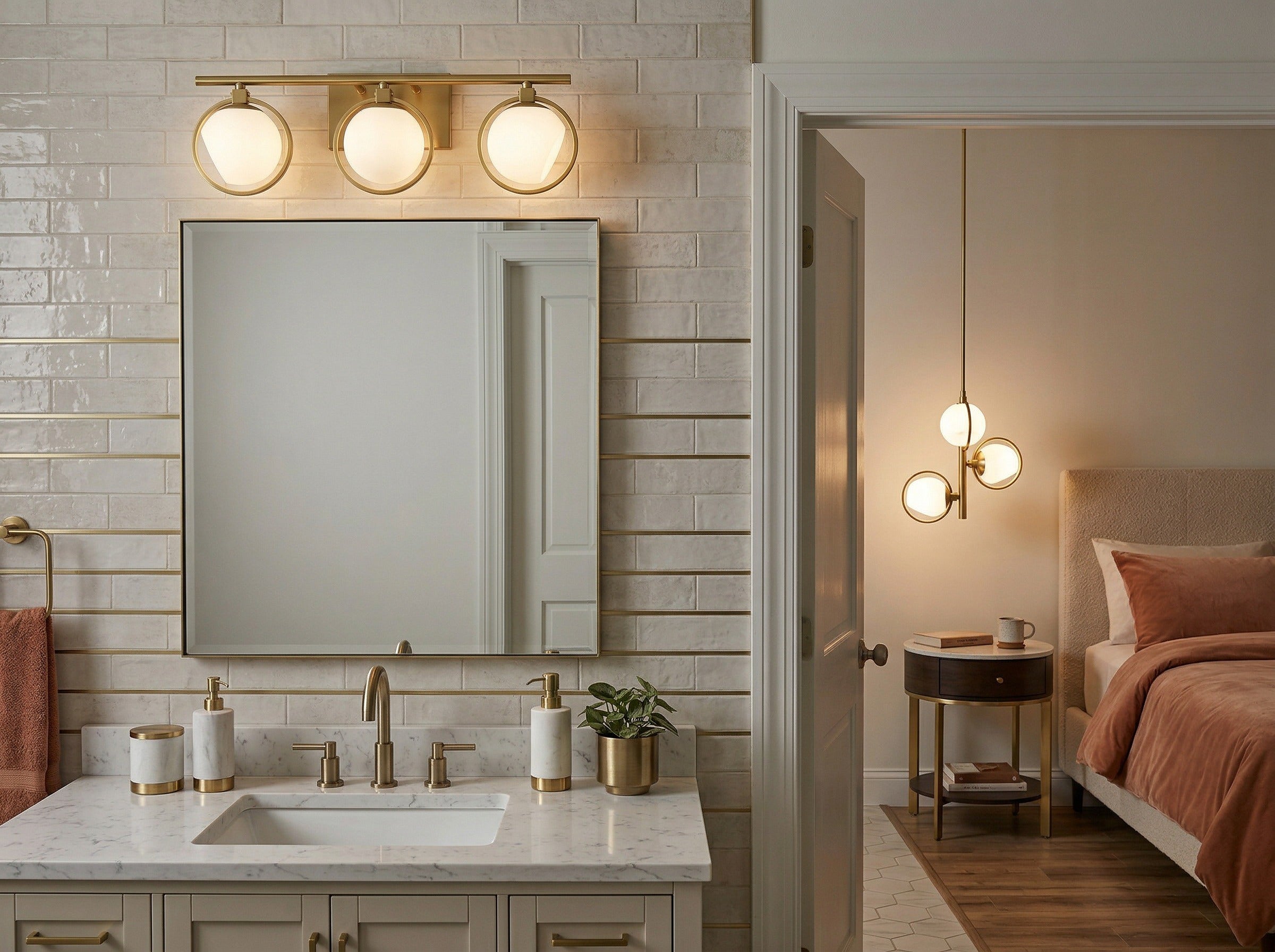 Bathroom with vanity mirror and sink, adjacent to a bedroom with a bed and nightstands.